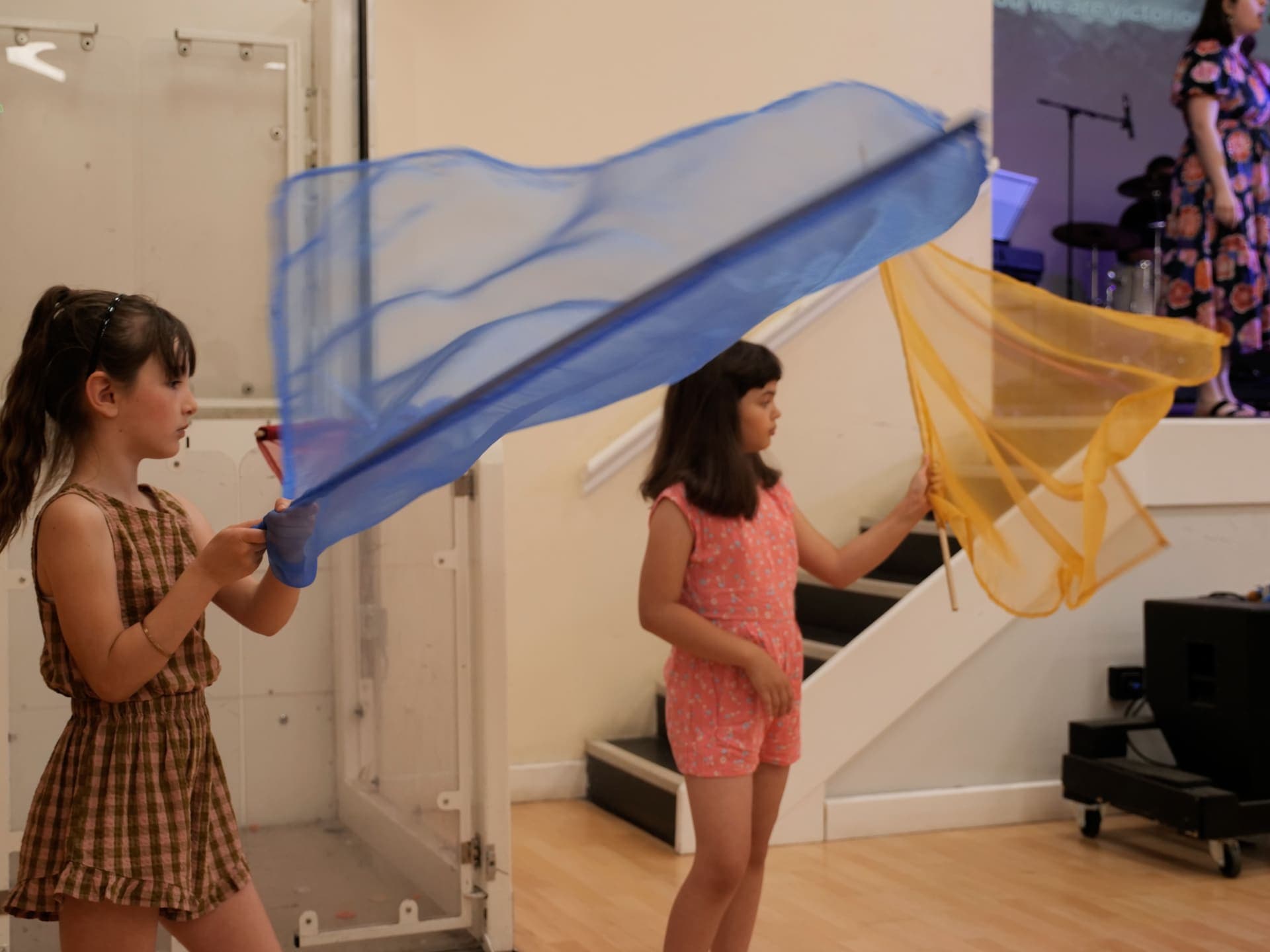 Children waving worship flags